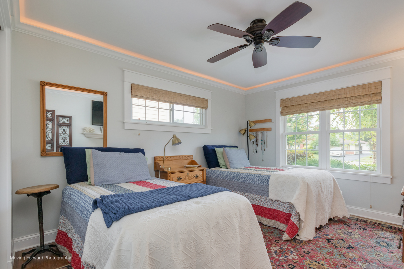 1845 Howard Street Wheaton, IL 60187 - Photo 32 of 41 a bedroom with two beds and a chandelier