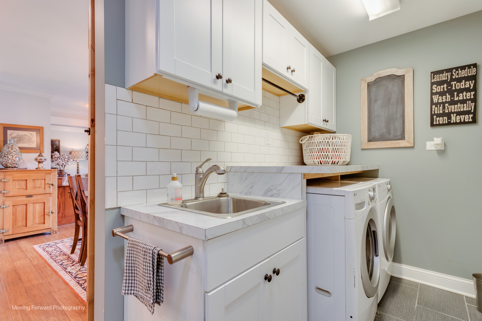 1845 Howard Street Wheaton, IL 60187 - Photo 37 of 41 a bathroom with a sink and a washer dryer