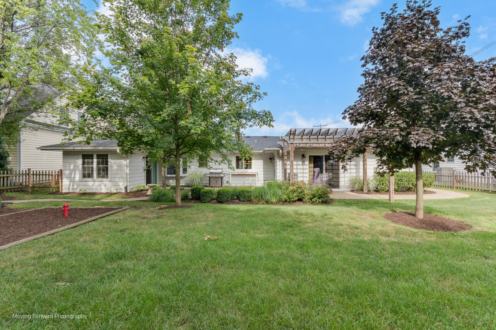 1845 Howard Street Wheaton, IL 60187 - Photo 41 of 41 a front view of a house with a yard and trees