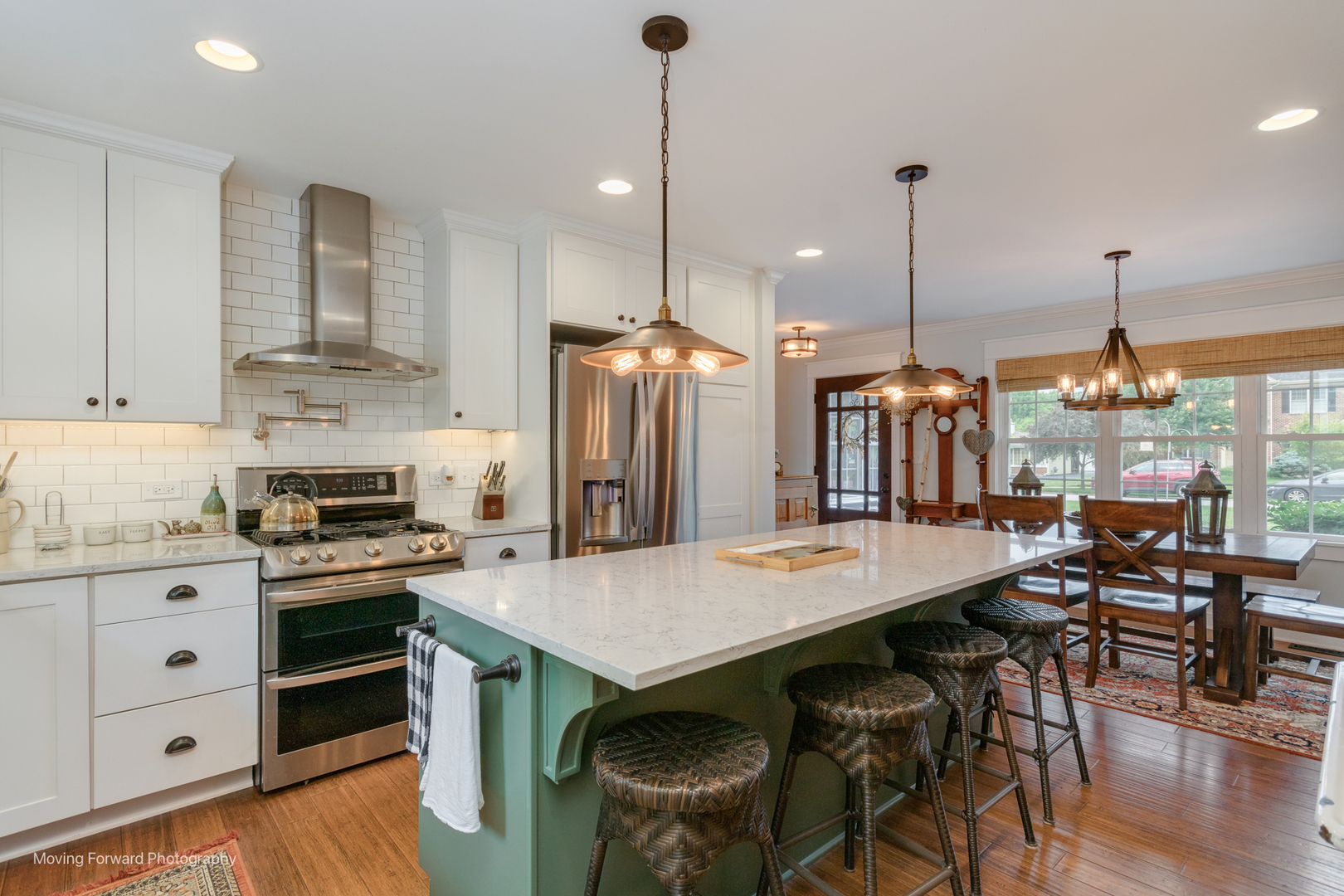 1845 Howard Street Wheaton, IL 60187 - Photo 7 of 41 a kitchen with stainless steel appliances granite countertop a stove a refrigerator a oven a dining table and chairs with wooden floor