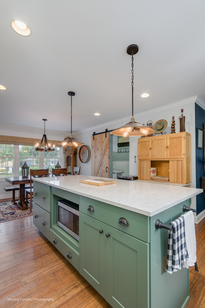 1845 Howard Street Wheaton, IL 60187 - Photo 9 of 41 a kitchen with kitchen island a stove and a sink
