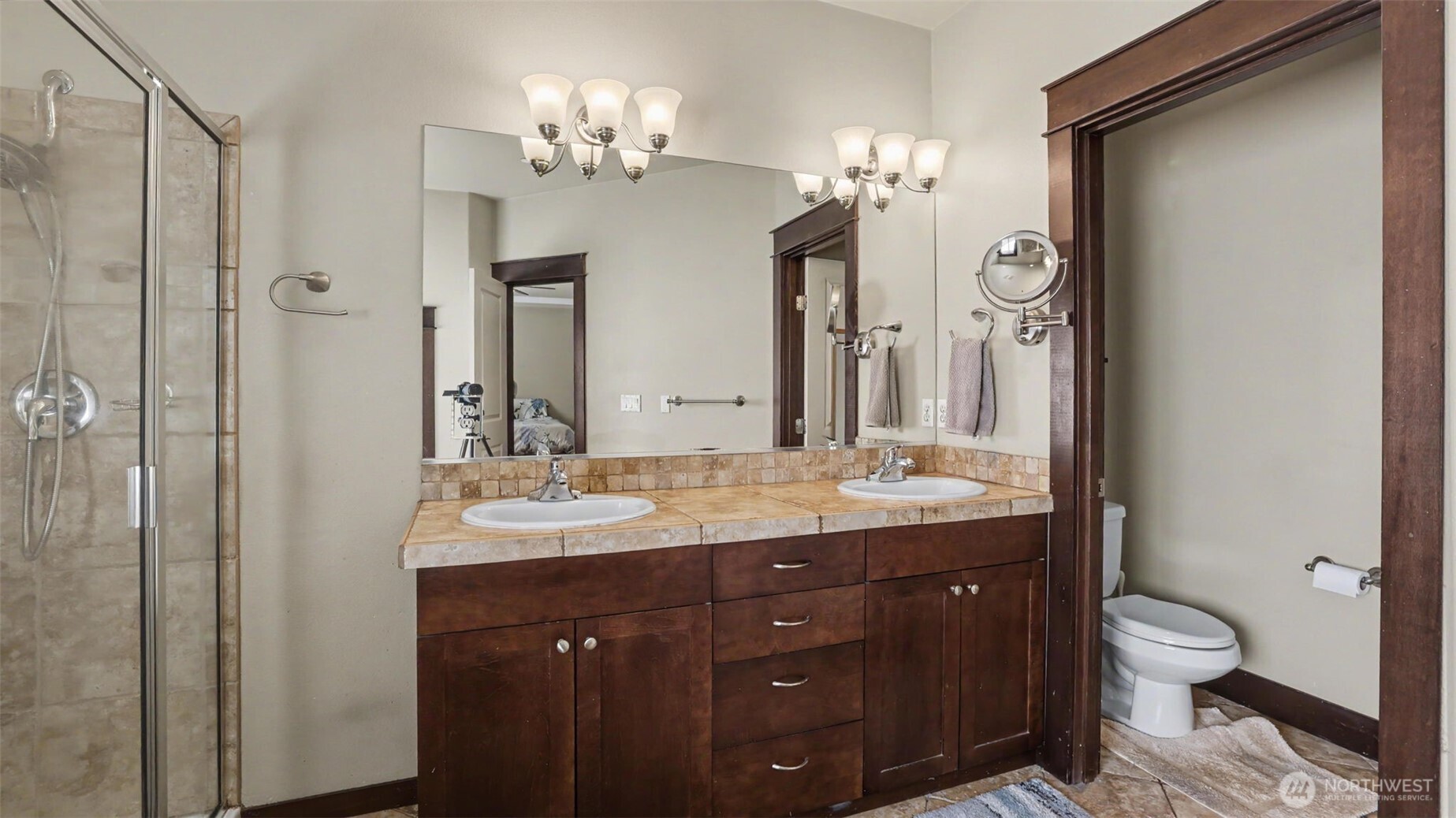 1357 Elma Place Northeast Renton, WA 98059 - Photo 20 of 40 a bathroom with a granite countertop sink a toilet and a mirror