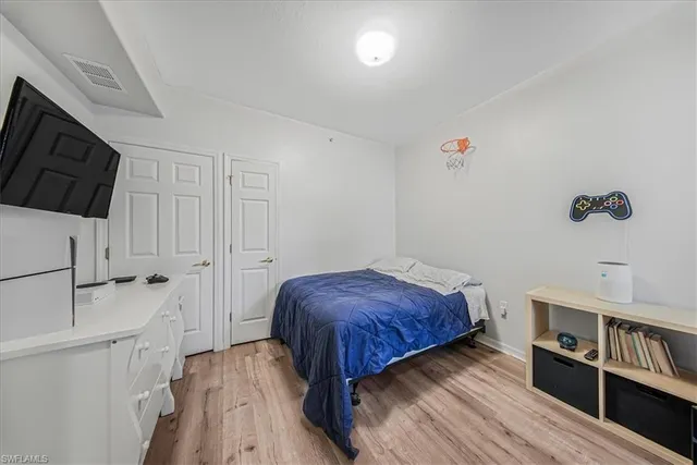 a bathroom with a sink a toilet a mirror and shower