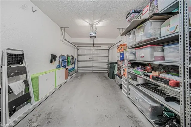a work room with furniture and potted plant