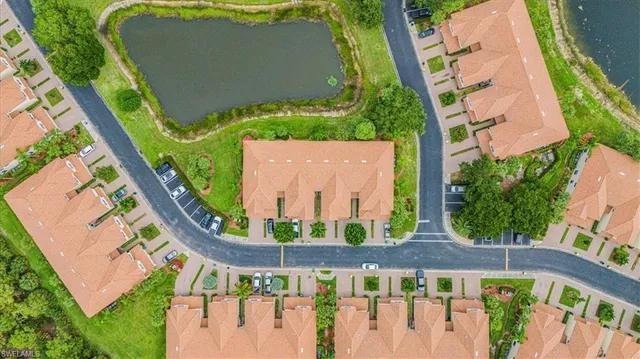 a view of a backyard with plants and outdoor seating