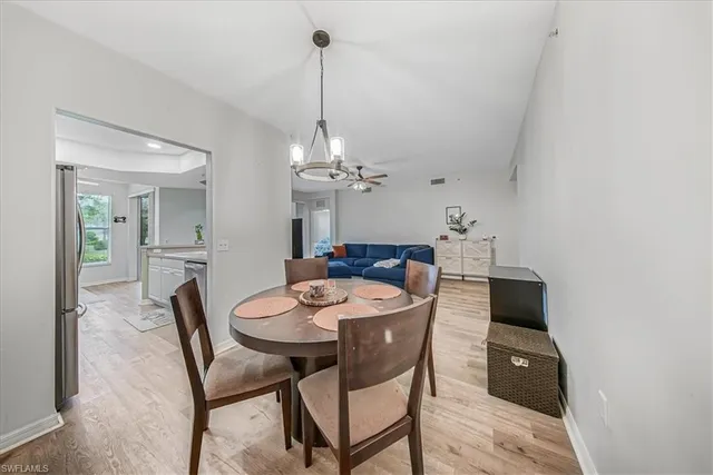 a kitchen with stainless steel appliances a refrigerator sink and stove top oven