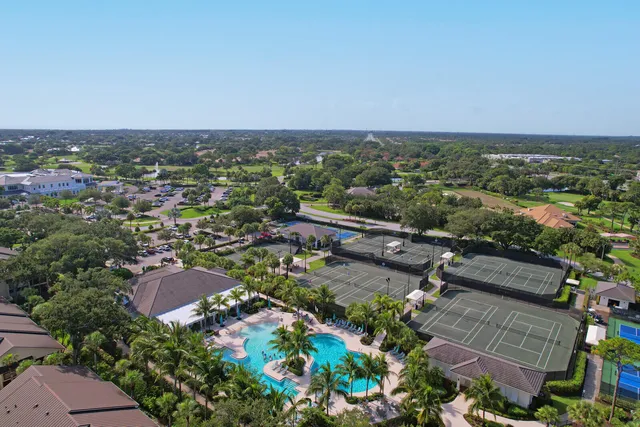 a front view of a house with a yard table and chairs