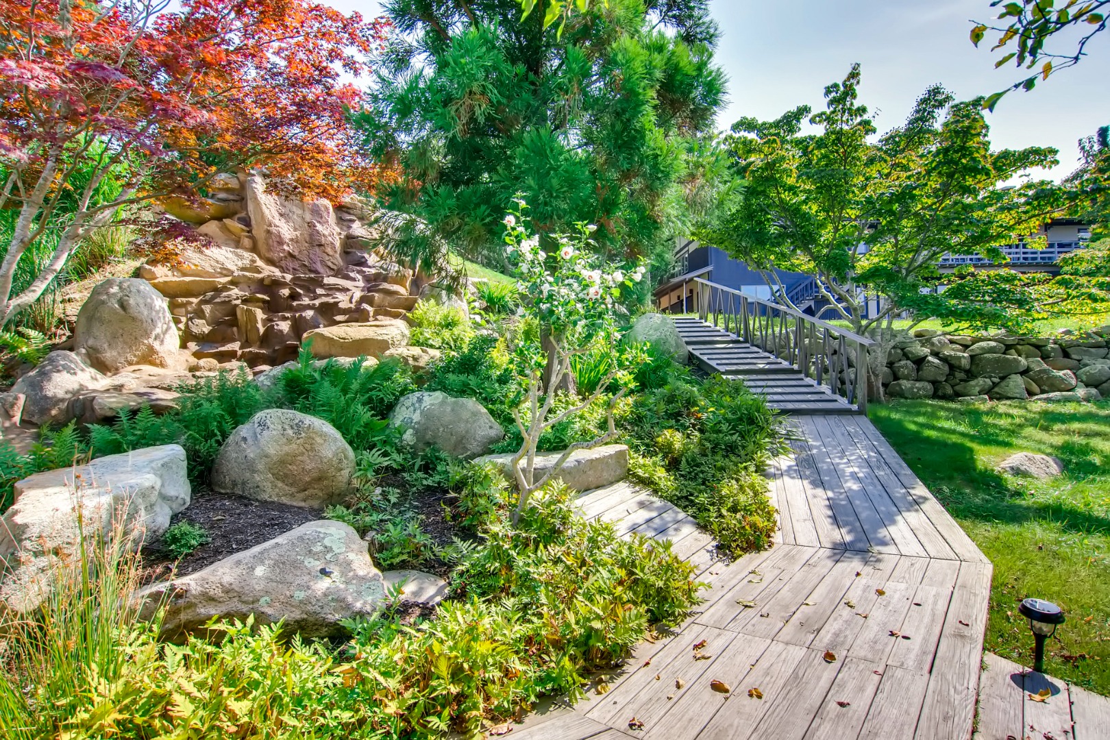 45 Beach Road Chilmark, MA 02535 - Photo 2 of 7 a backyard of a house with lots of green space