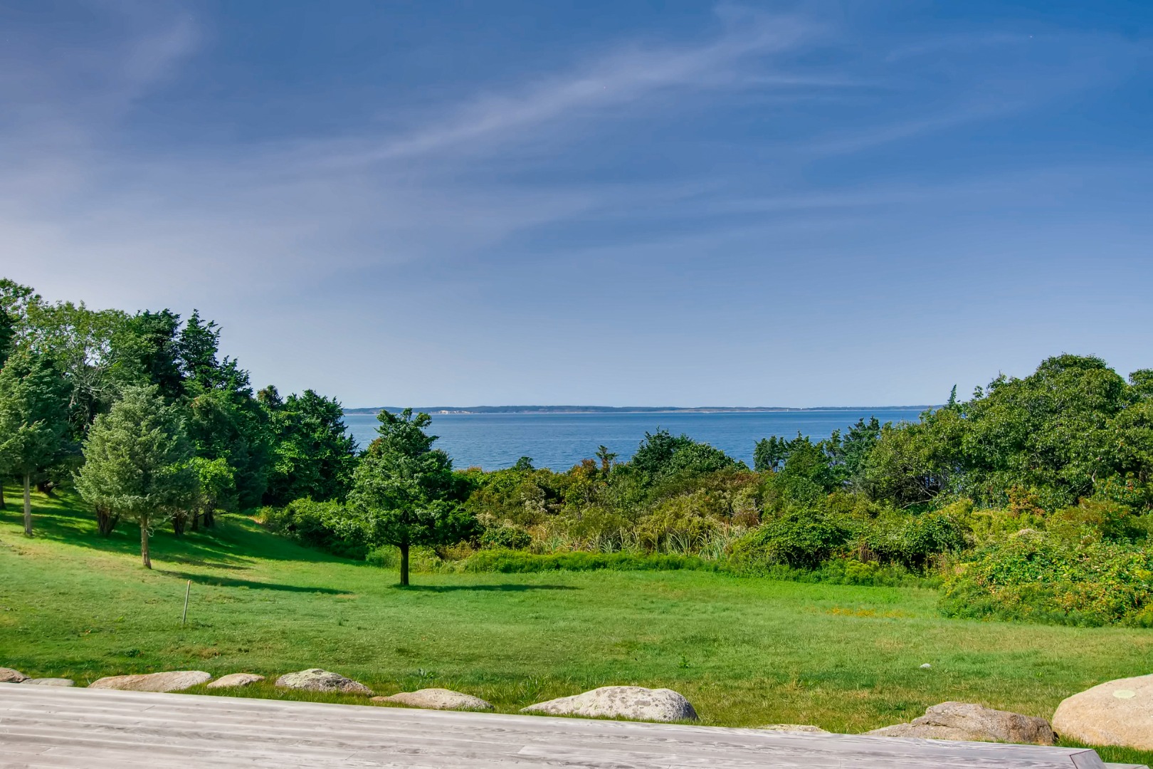 45 Beach Road Chilmark, MA 02535 - Photo 6 of 7 a view of a grassy field with trees