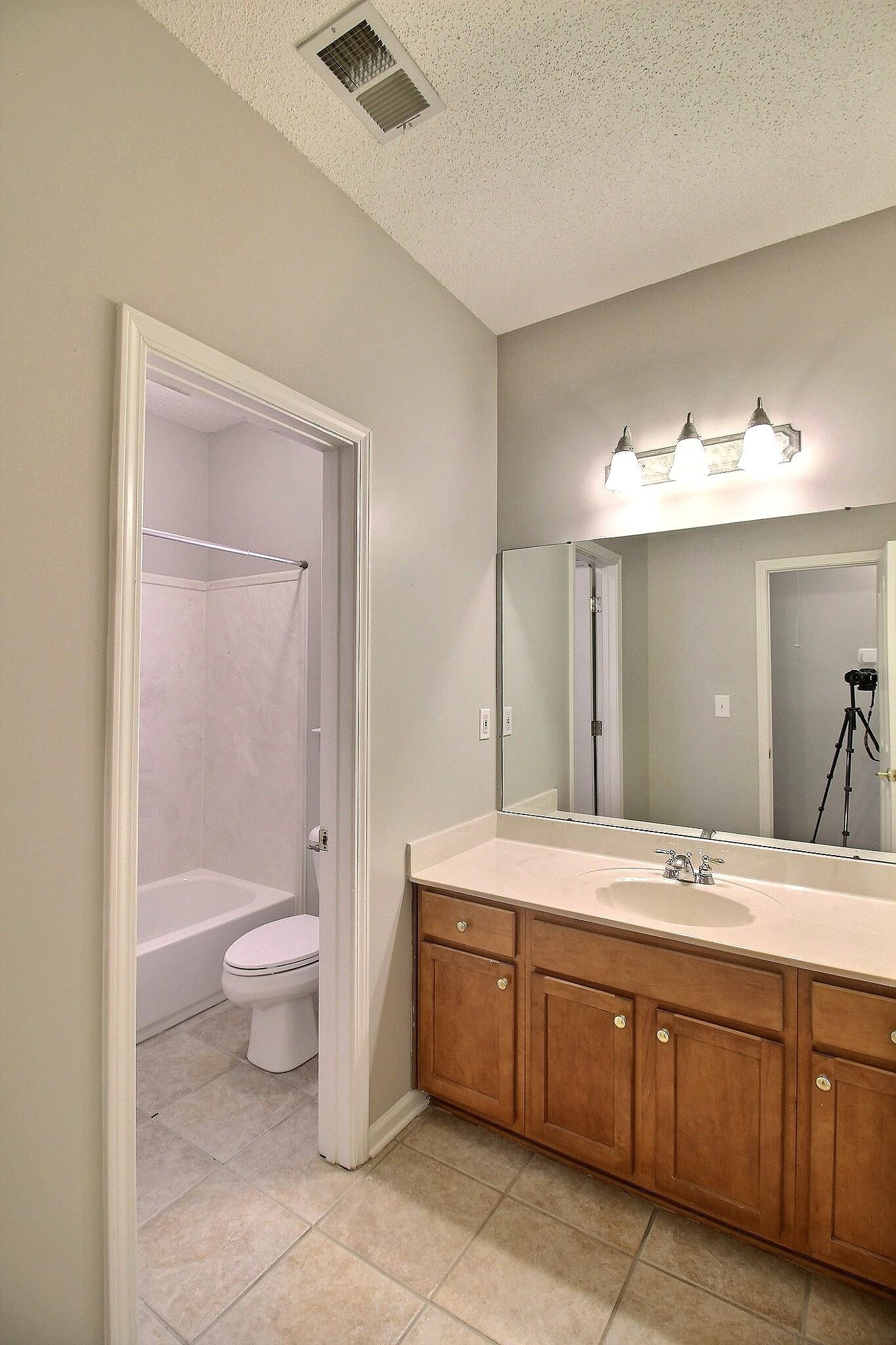 845 McFerrin Lane Collierville, TN 38017 - Photo 20 of 27 a spacious bathroom with a granite countertop sink toilet and mirror
