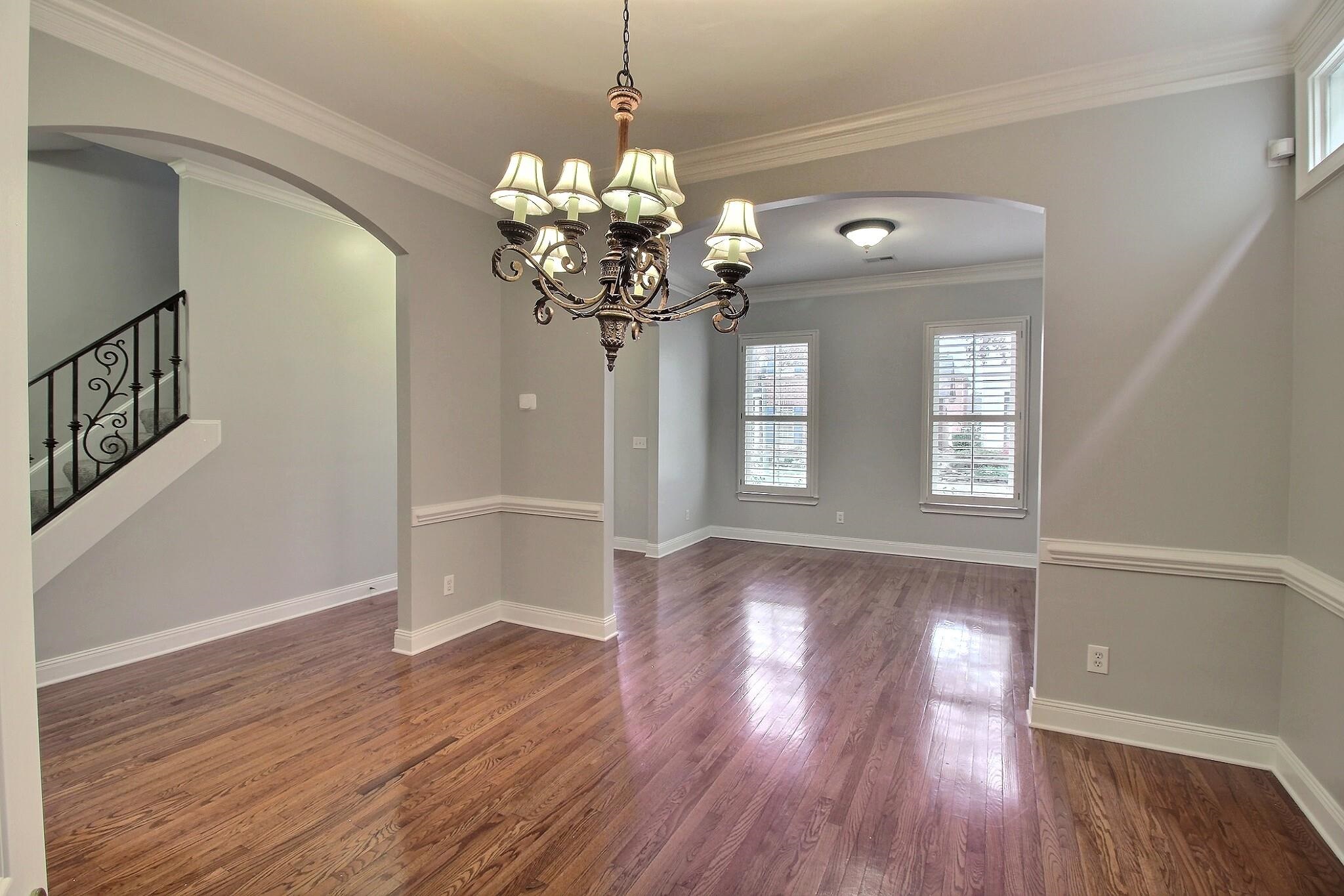845 McFerrin Lane Collierville, TN 38017 - Photo 2 of 27 a view of a room with wooden floor and chandelier