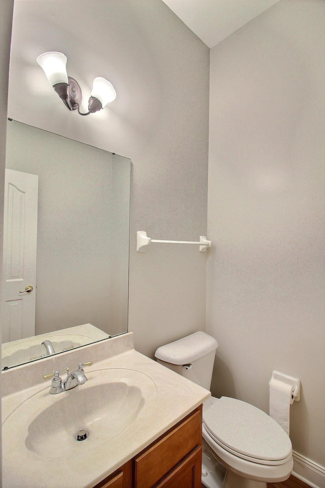 845 McFerrin Lane Collierville, TN 38017 - Photo 22 of 27 a bathroom with a sink a toilet and mirror