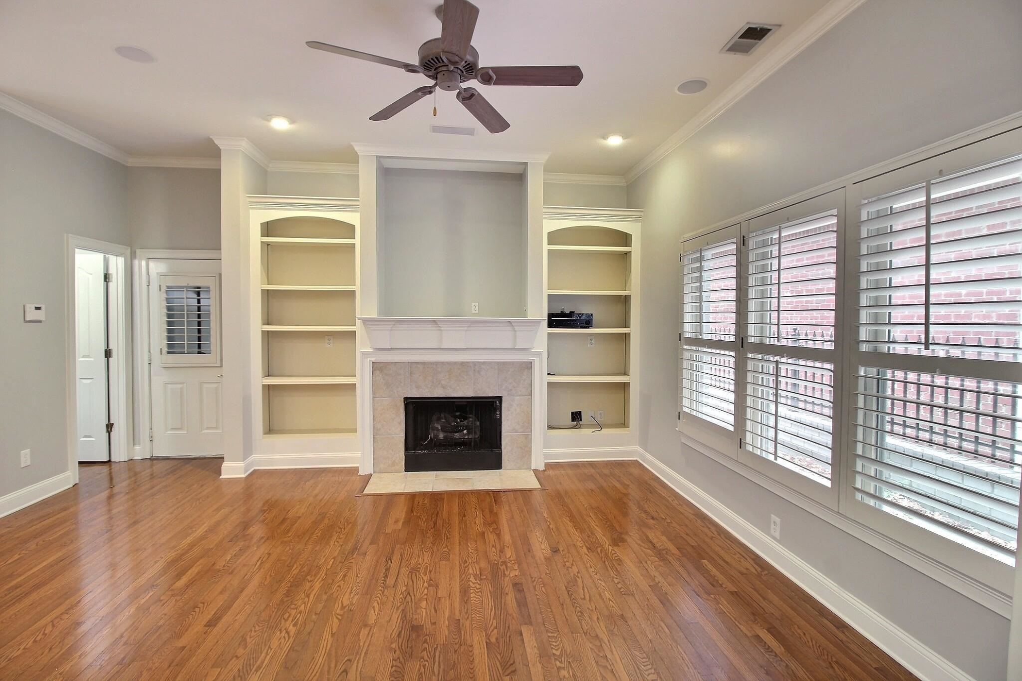 845 McFerrin Lane Collierville, TN 38017 - Photo 3 of 27 a view of empty room with wooden floor and fireplace
