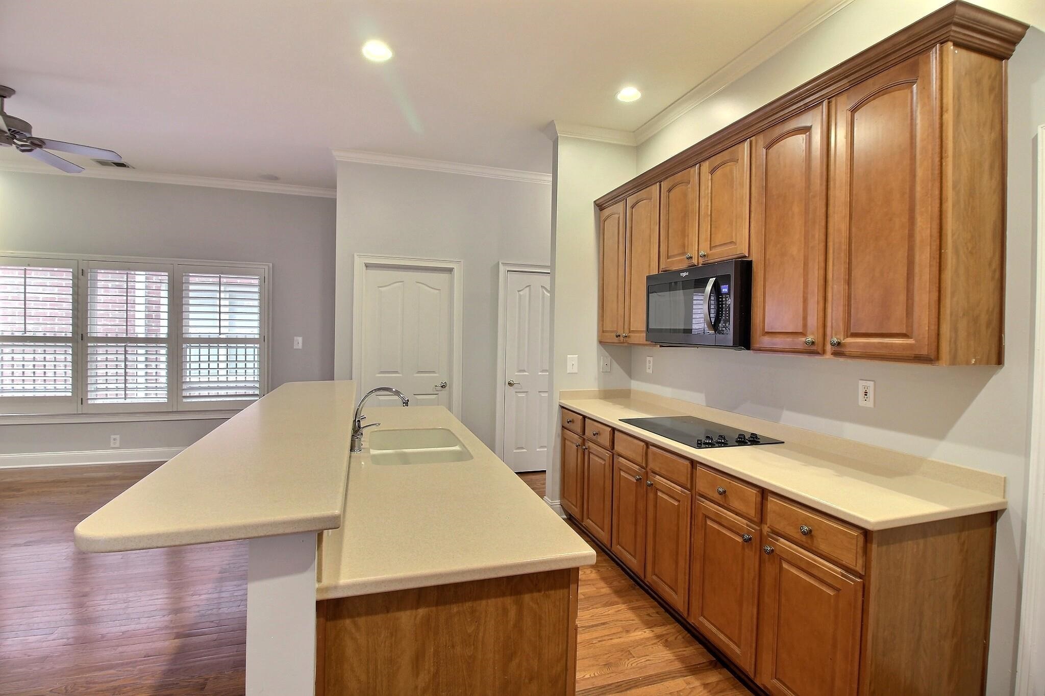 845 McFerrin Lane Collierville, TN 38017 - Photo 5 of 27 a kitchen with a sink a stove and cabinets