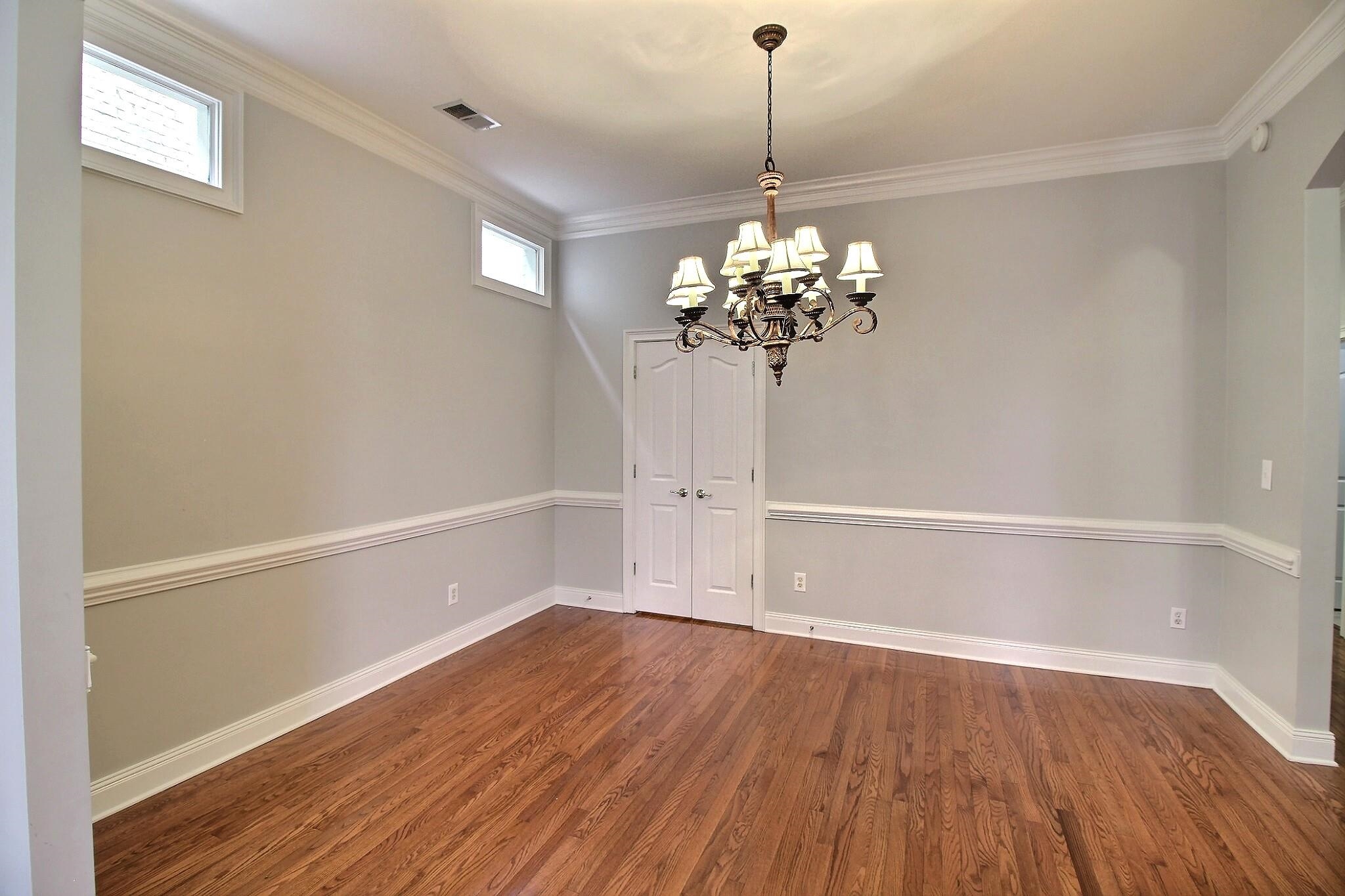 845 McFerrin Lane Collierville, TN 38017 - Photo 9 of 27 a view of a room with wooden floor and chandelier