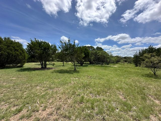 a view of a backyard of a house