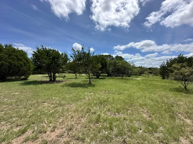 a view of a backyard of a house