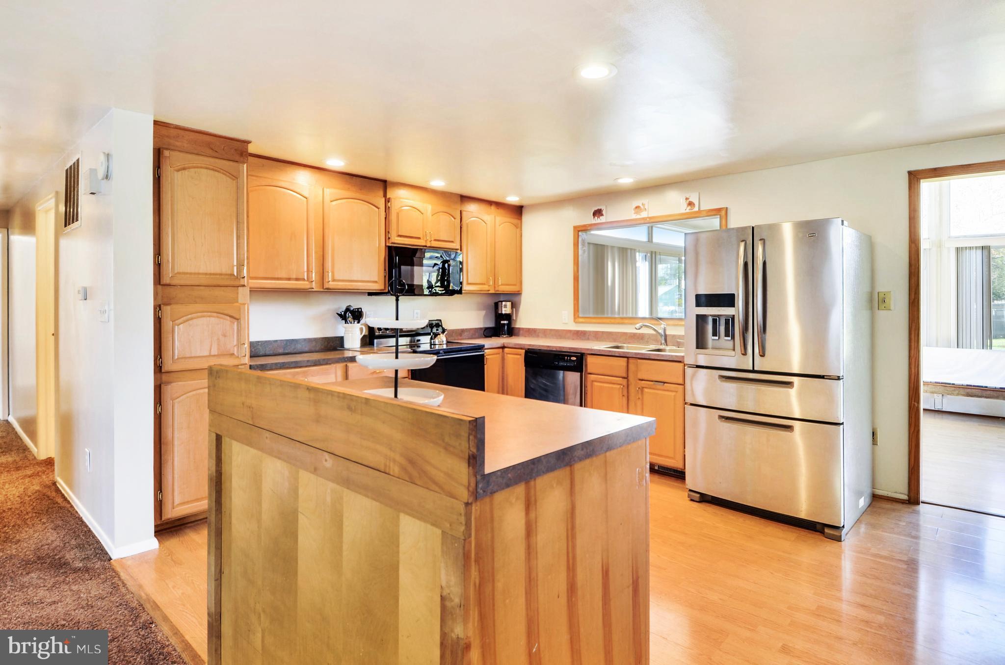 17316 Whitaker Road Poolesville, MD 20837 - Photo 3 of 30 Sun-Filled Kitchen with Rolling Island