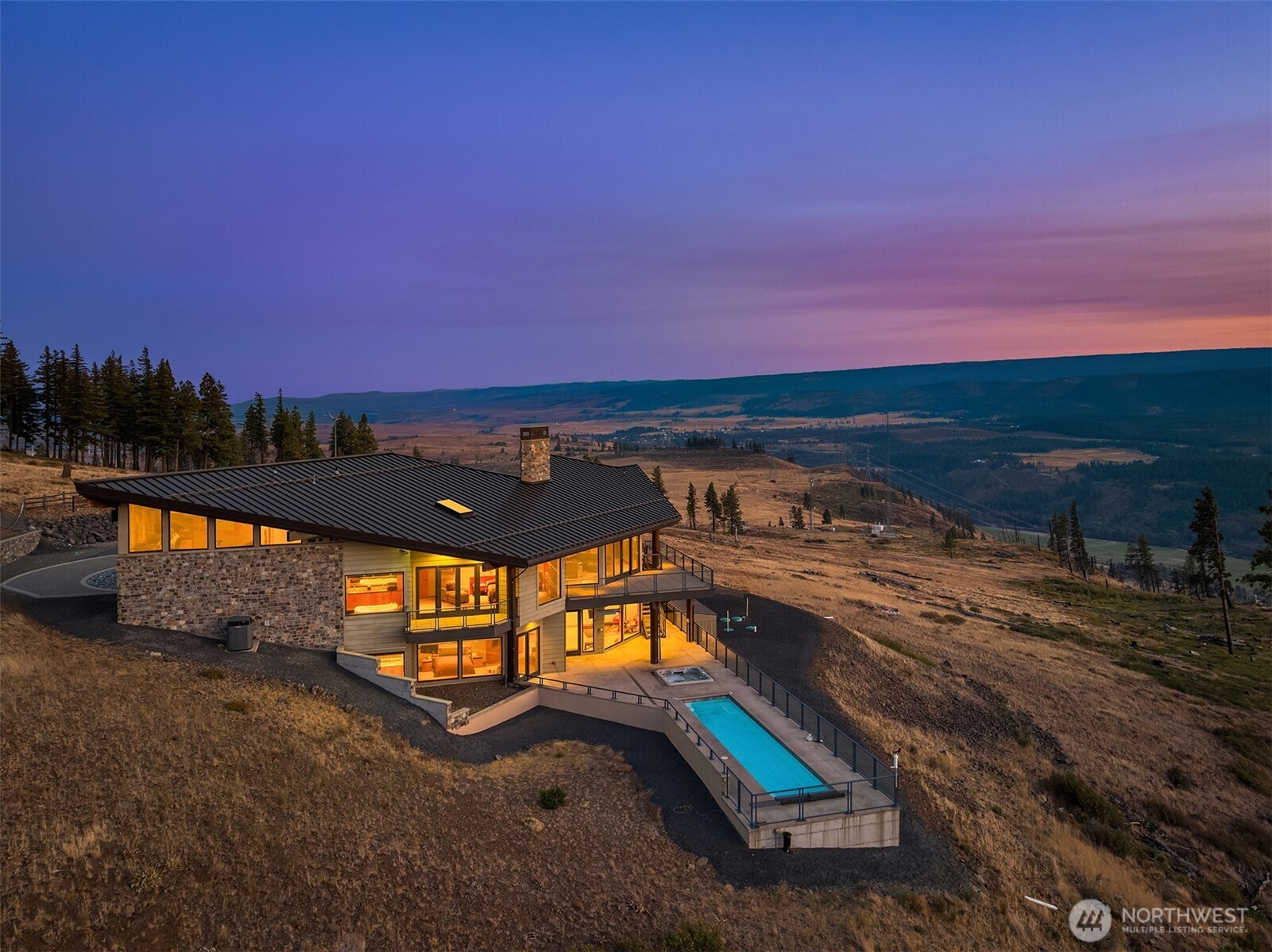 3653 Hart Road Cle Elum, WA 98922 - Photo 2 of 40 a view of a swimming pool with a table and chairs
