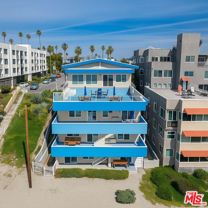 28 South 5th Place Long Beach, CA 90802 - Photo 12 of 15 a front view of a building with glass windows and outdoor seating