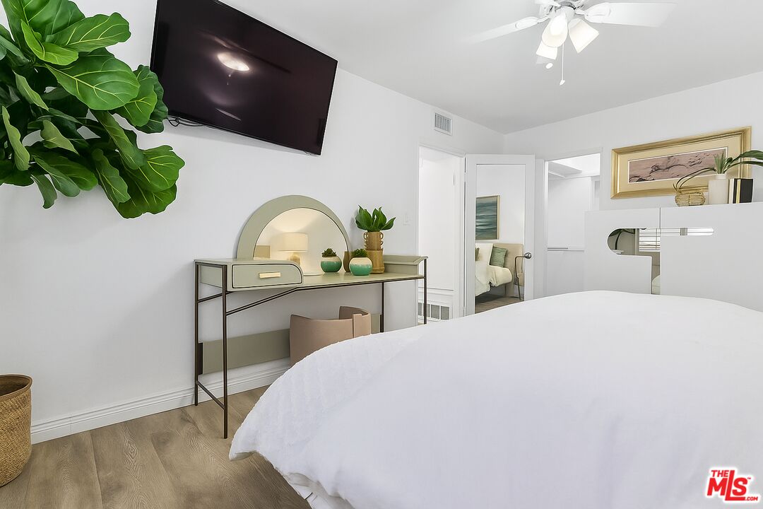 28 South 5th Place Long Beach, CA 90802 - Photo 6 of 15 a bedroom with a bed and a flat screen tv