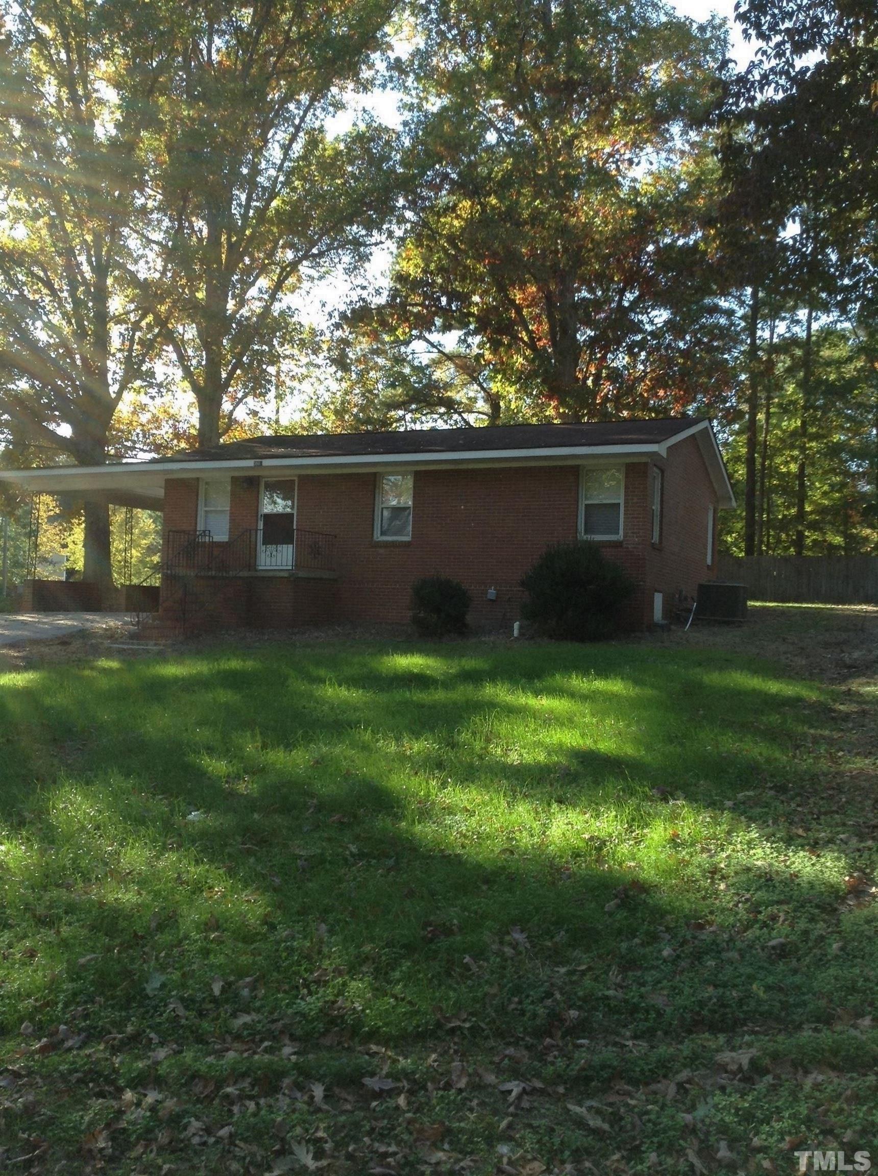 3901 Rock Quarry Road Raleigh, NC 27610 - Photo 1 of 10 a view of house with backyard space