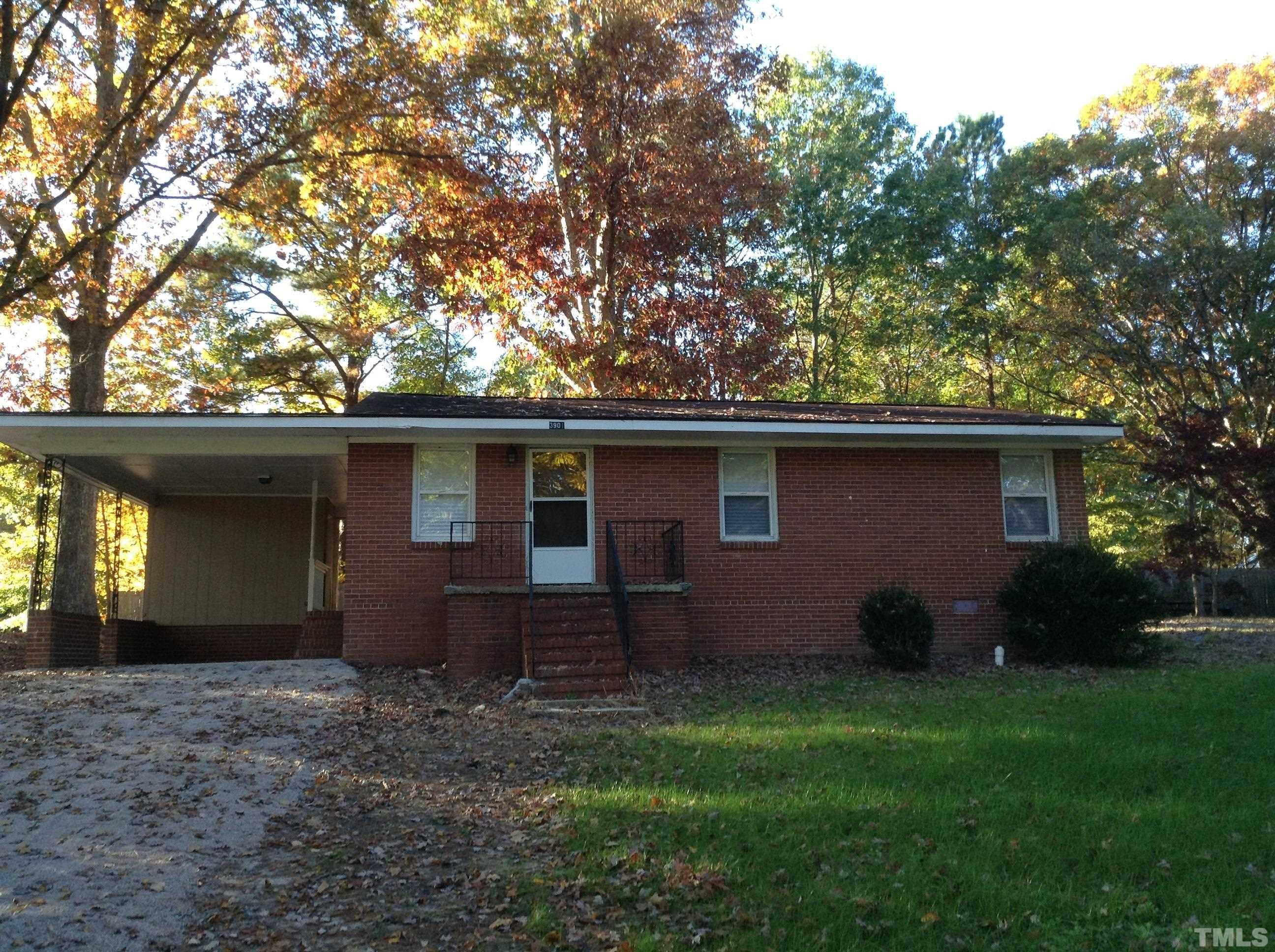 3901 Rock Quarry Road Raleigh, NC 27610 - Photo 2 of 10 a backyard of a house with lots of green space