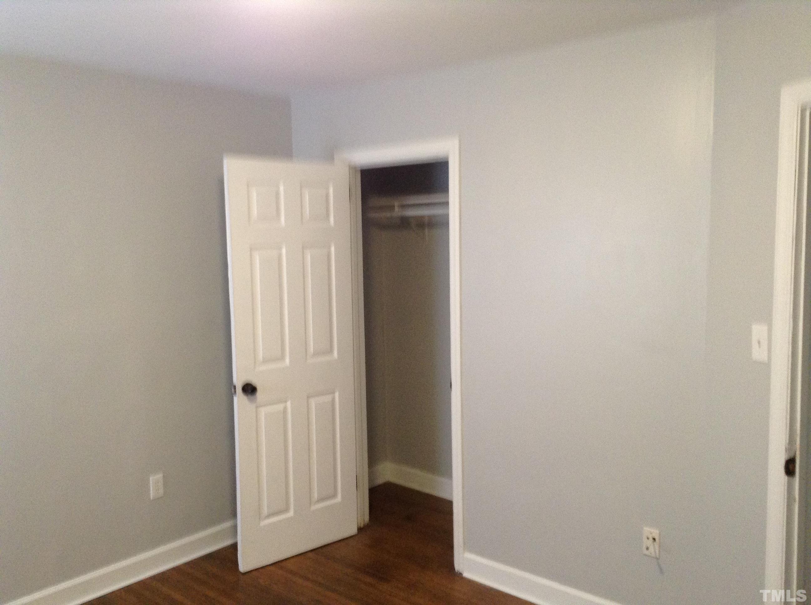 3901 Rock Quarry Road Raleigh, NC 27610 - Photo 10 of 10 a view of a hallway with wooden floor