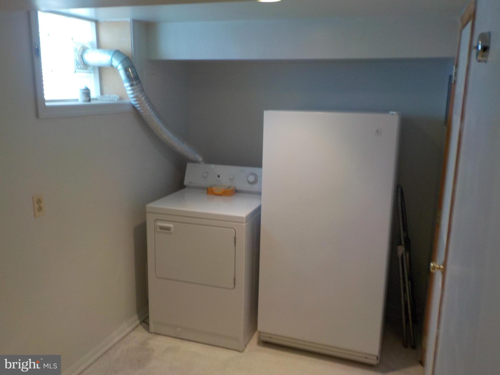 5437 Channing Road Baltimore, MD 21229 - Photo 22 of 25 a utility room with dryer and washer