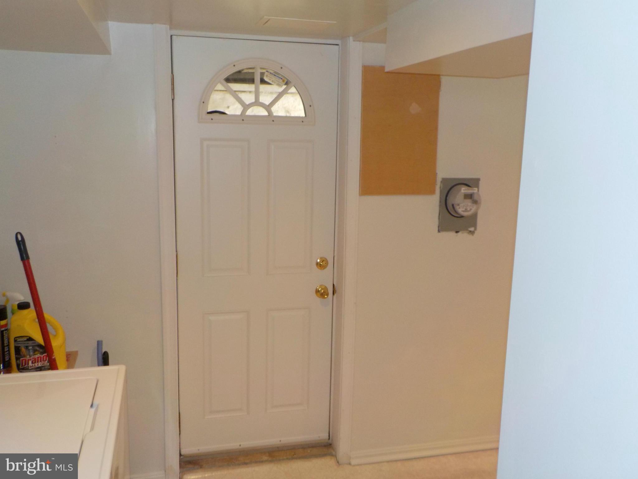 5437 Channing Road Baltimore, MD 21229 - Photo 24 of 25 a view of a livingroom with front door