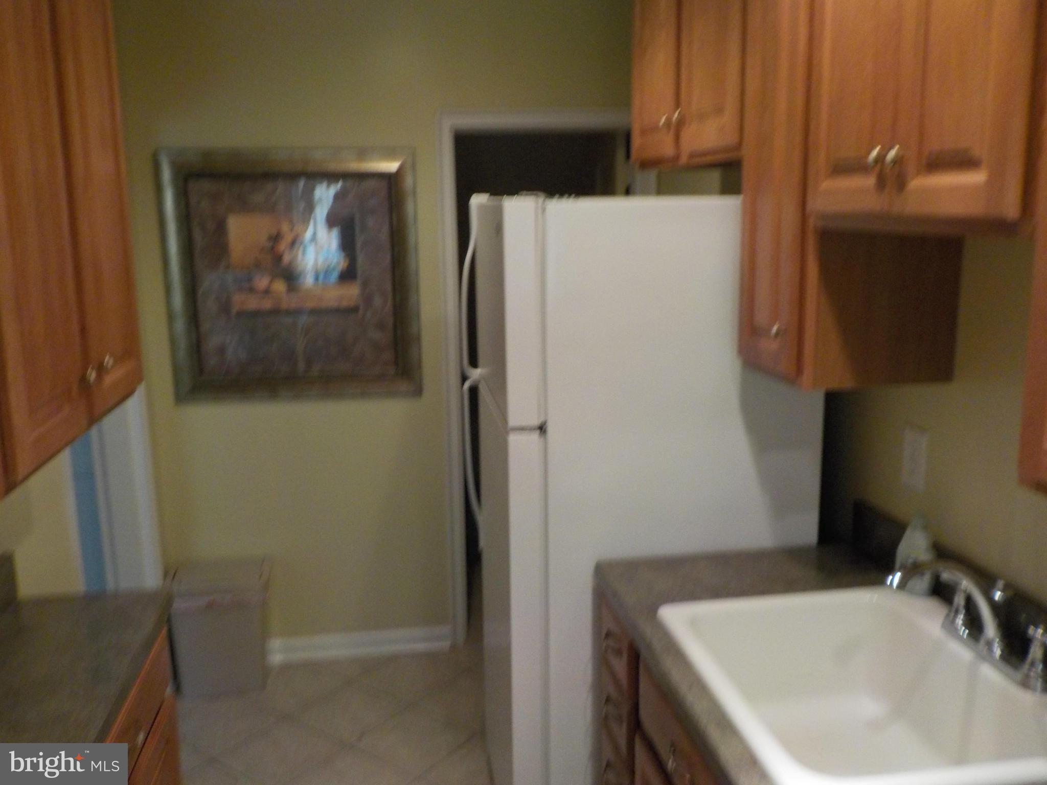 5437 Channing Road Baltimore, MD 21229 - Photo 8 of 25 a bathroom with a sink and mirror