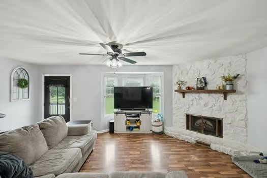 1280 McCrary Road Lebanon, TN 37090 - Photo 11 of 46 a living room with furniture a flat screen tv and a fireplace