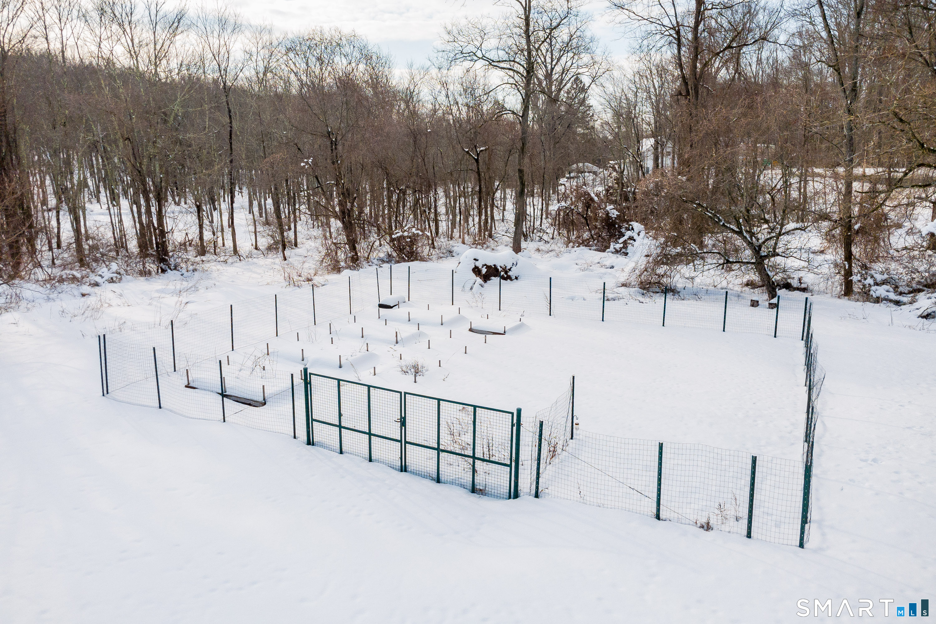 73 Dodgingtown Road Newtown, CT 06470 - Photo 15 of 39 a view of white house covered in snow