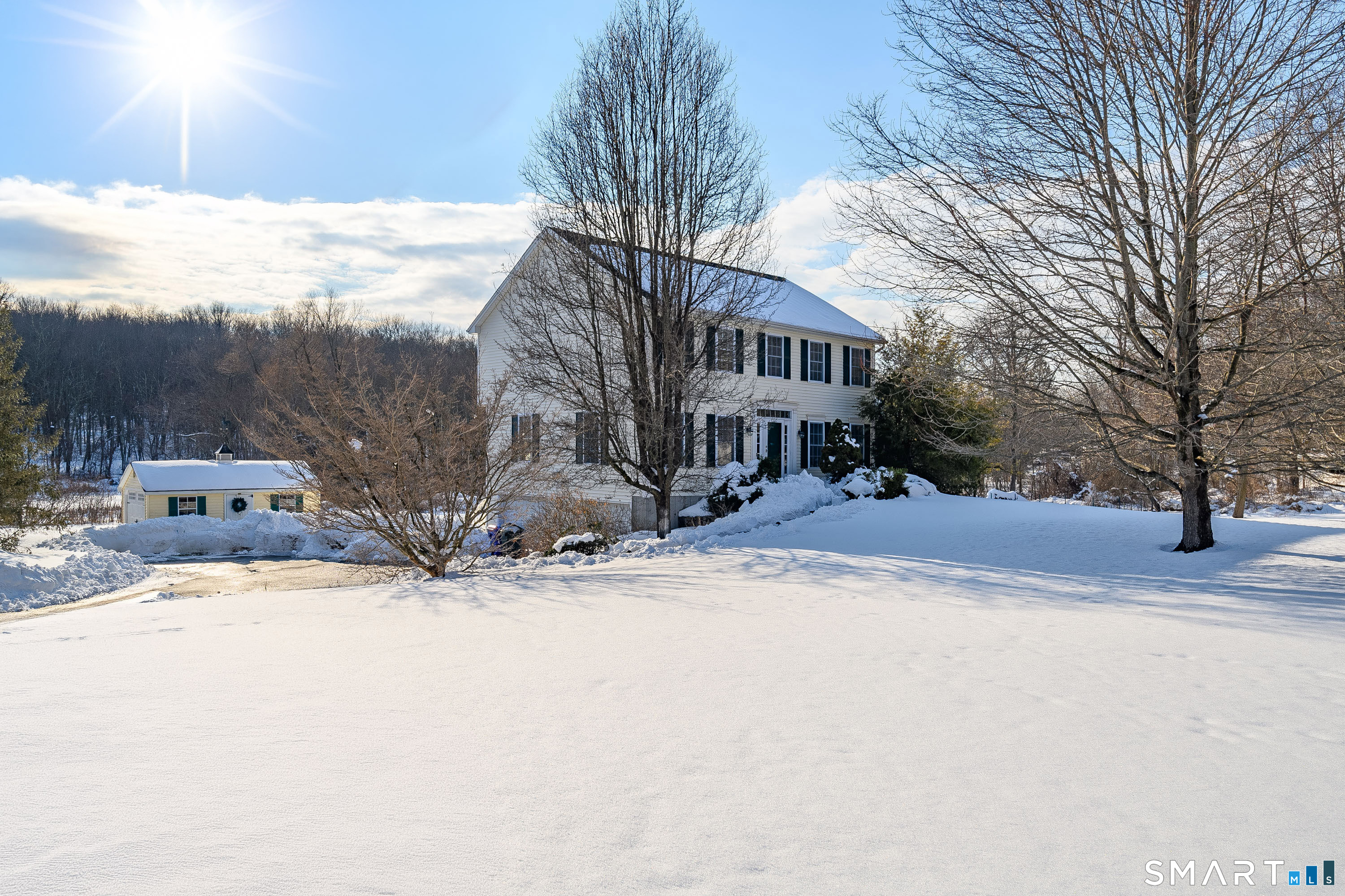 73 Dodgingtown Road Newtown, CT 06470 - Photo 18 of 39 a street view covered with snow