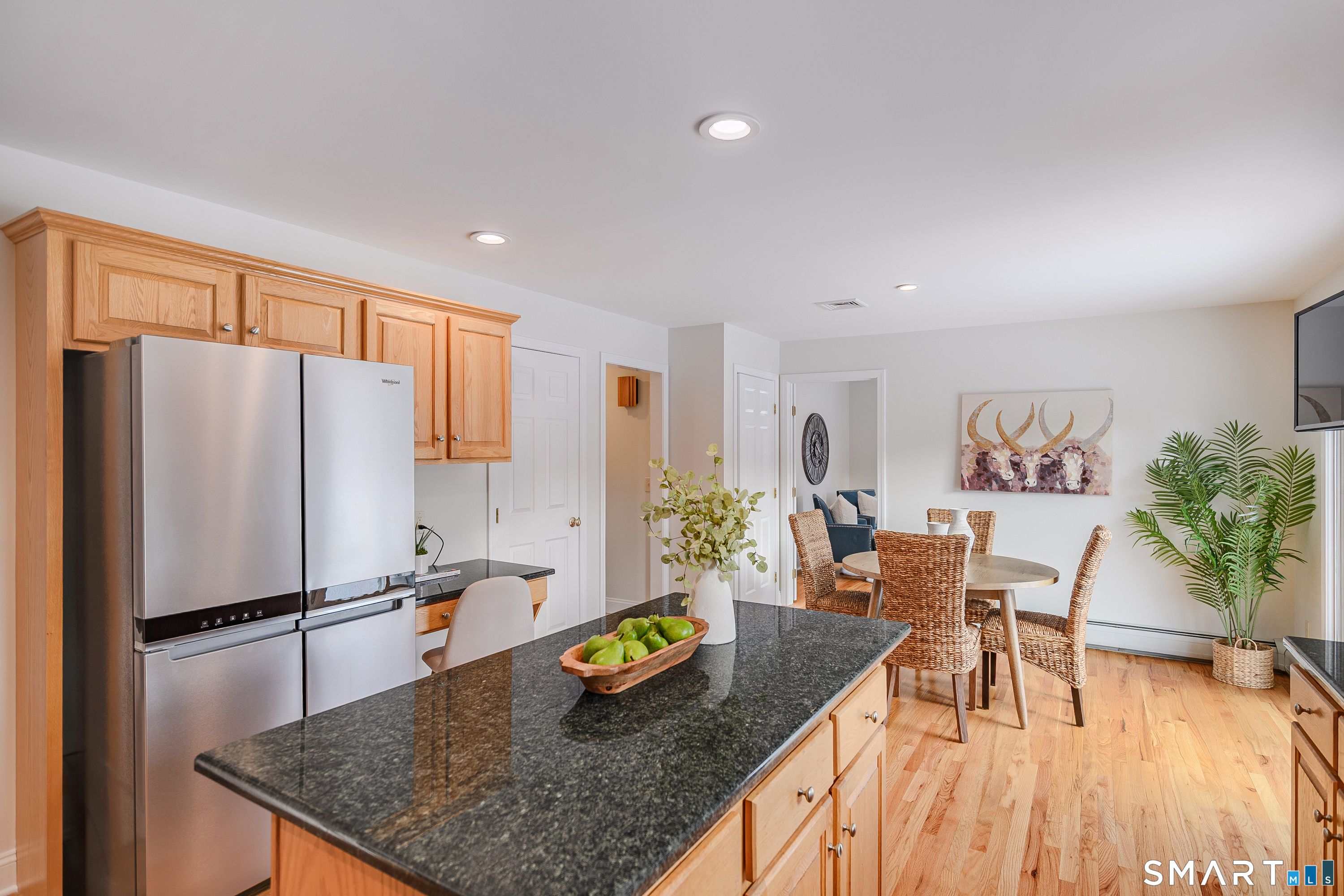 73 Dodgingtown Road Newtown, CT 06470 - Photo 22 of 39 a kitchen with stainless steel appliances granite countertop a refrigerator table and chairs