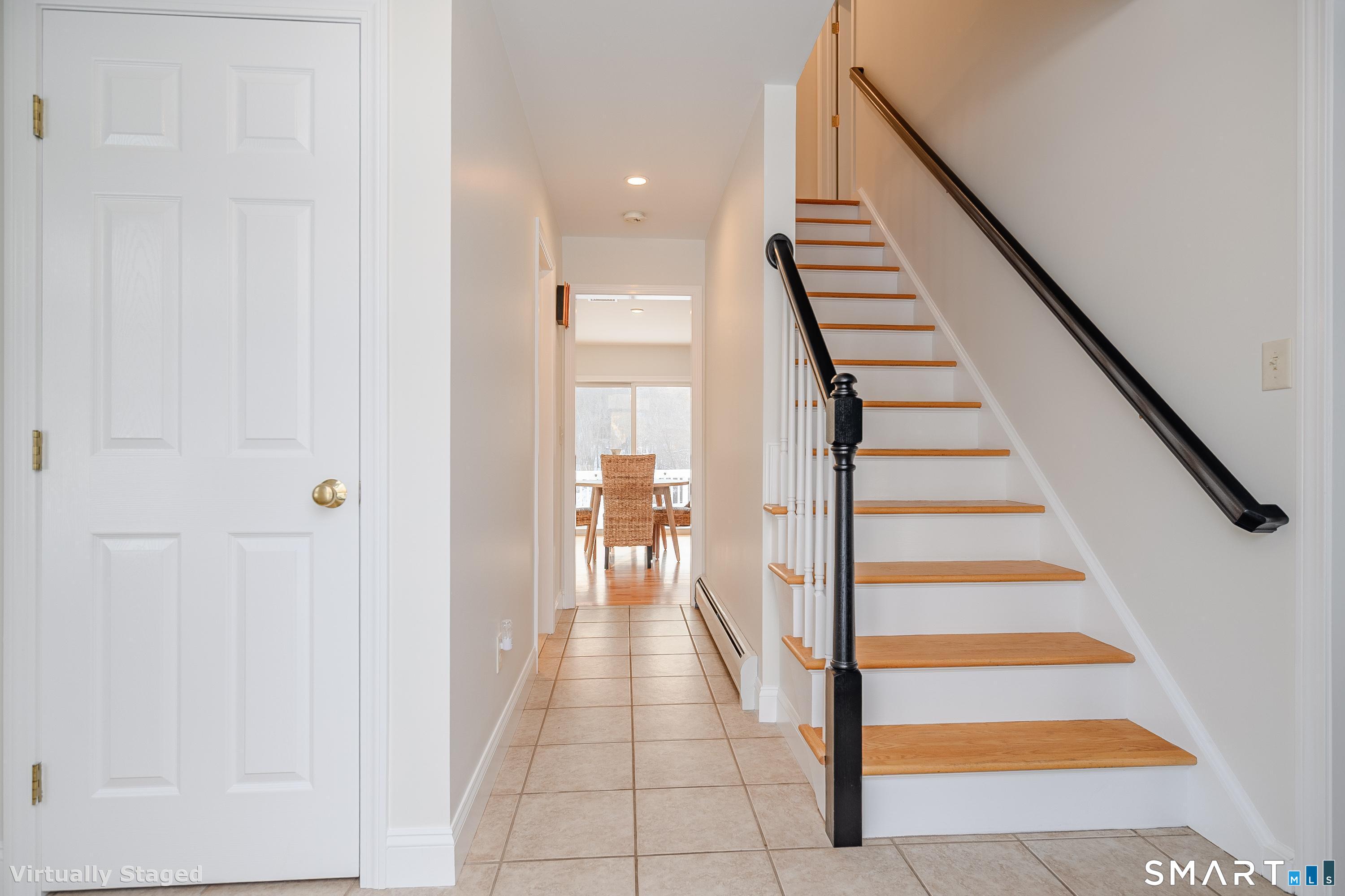 73 Dodgingtown Road Newtown, CT 06470 - Photo 23 of 39 a view of a hallway with stairs and wooden floor