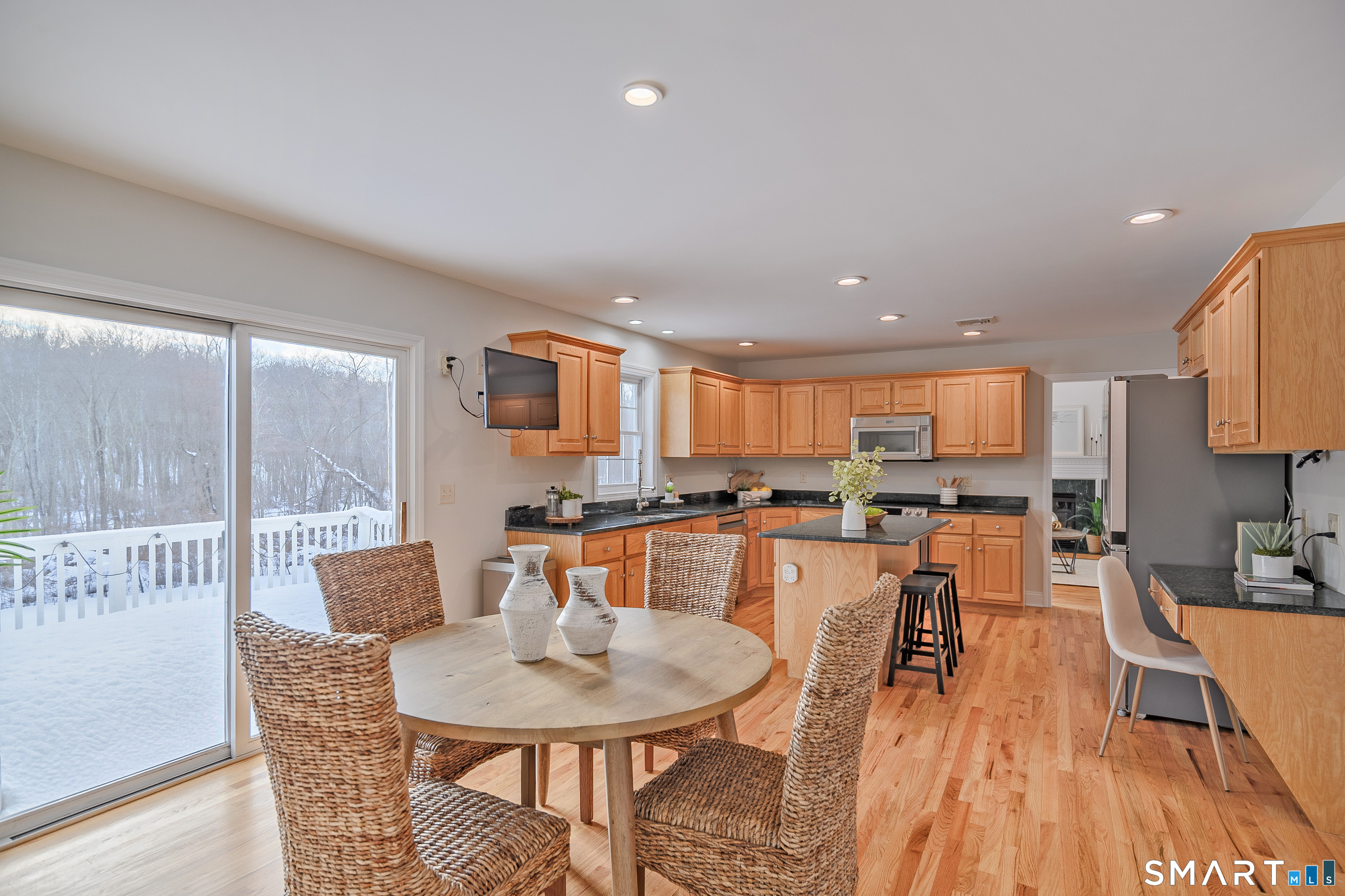 73 Dodgingtown Road Newtown, CT 06470 - Photo 25 of 39 a large kitchen with a table and chairs