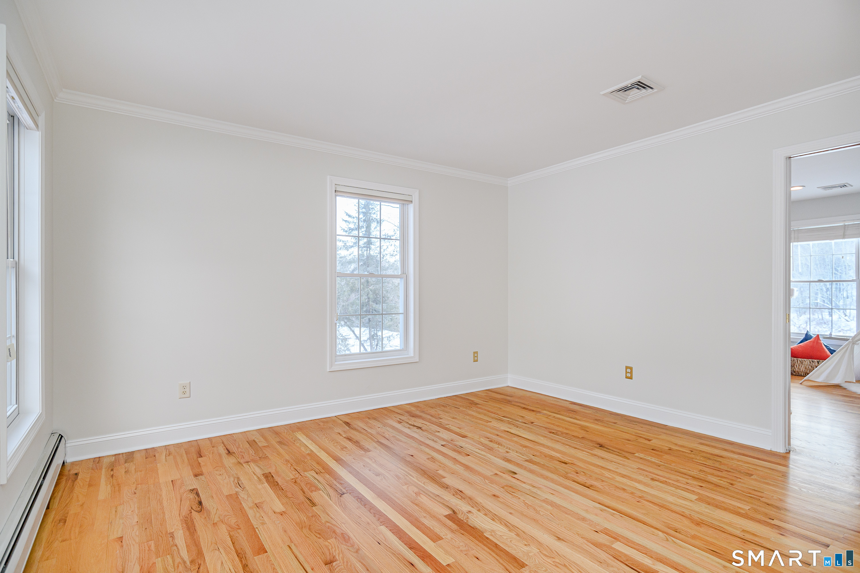73 Dodgingtown Road Newtown, CT 06470 - Photo 28 of 39 a view of empty room with wooden floor and fan