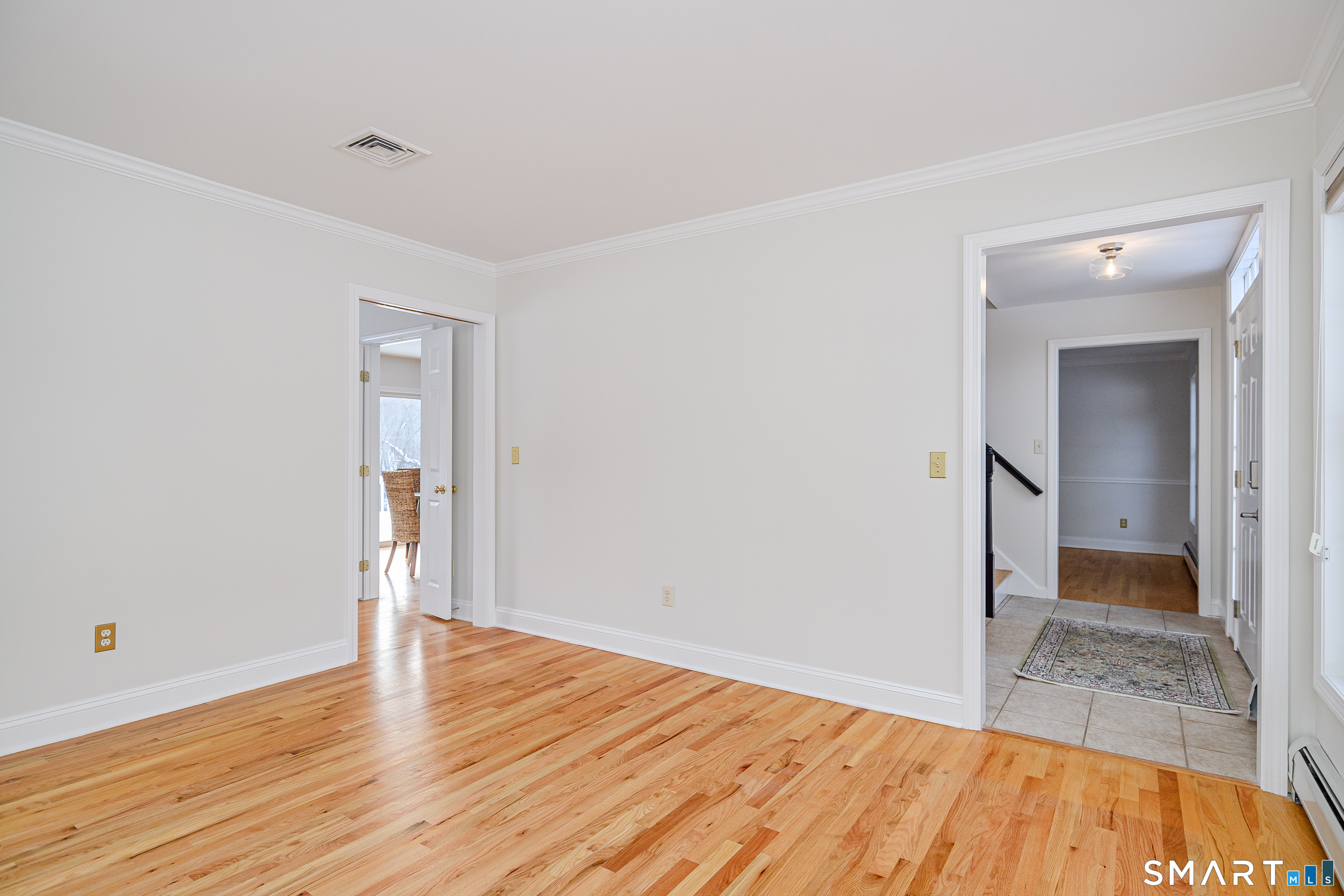 73 Dodgingtown Road Newtown, CT 06470 - Photo 29 of 39 a view of a room with wooden floor and a bathroom