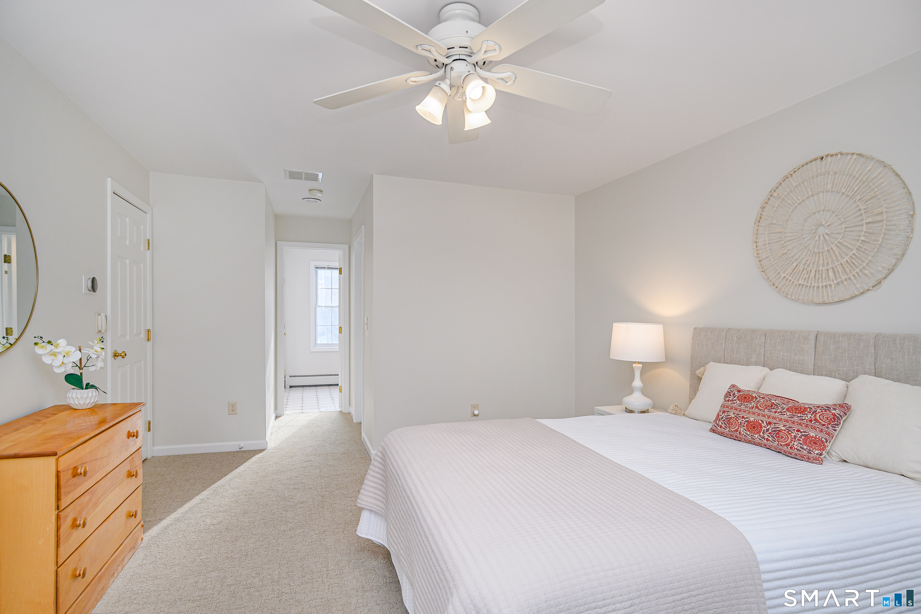 73 Dodgingtown Road Newtown, CT 06470 - Photo 3 of 39 a bedroom with a bed and a chandelier