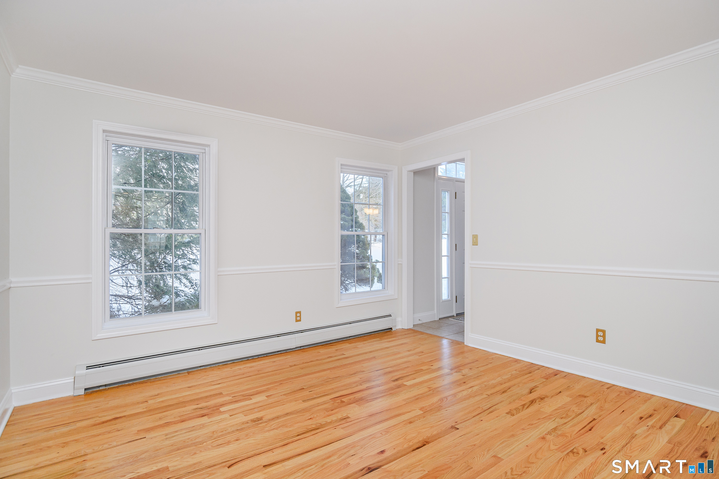 73 Dodgingtown Road Newtown, CT 06470 - Photo 32 of 39 an empty room with wooden floor and windows