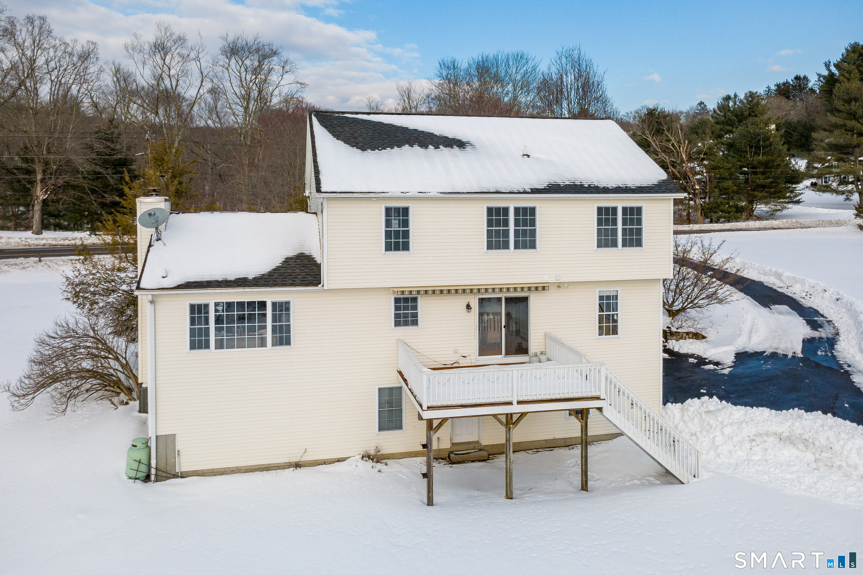 73 Dodgingtown Road Newtown, CT 06470 - Photo 35 of 39 a view of a white house with a yard and furniture