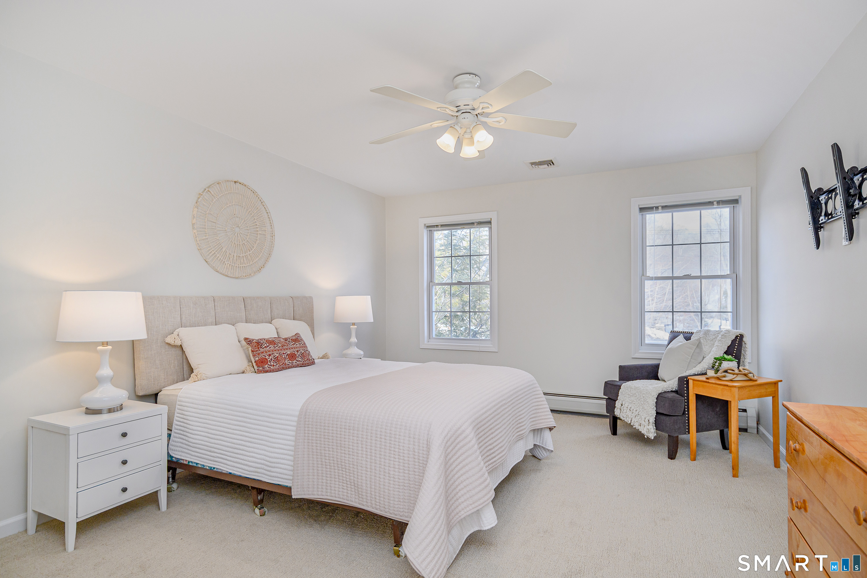 73 Dodgingtown Road Newtown, CT 06470 - Photo 4 of 39 a bedroom with a bed and a chandelier