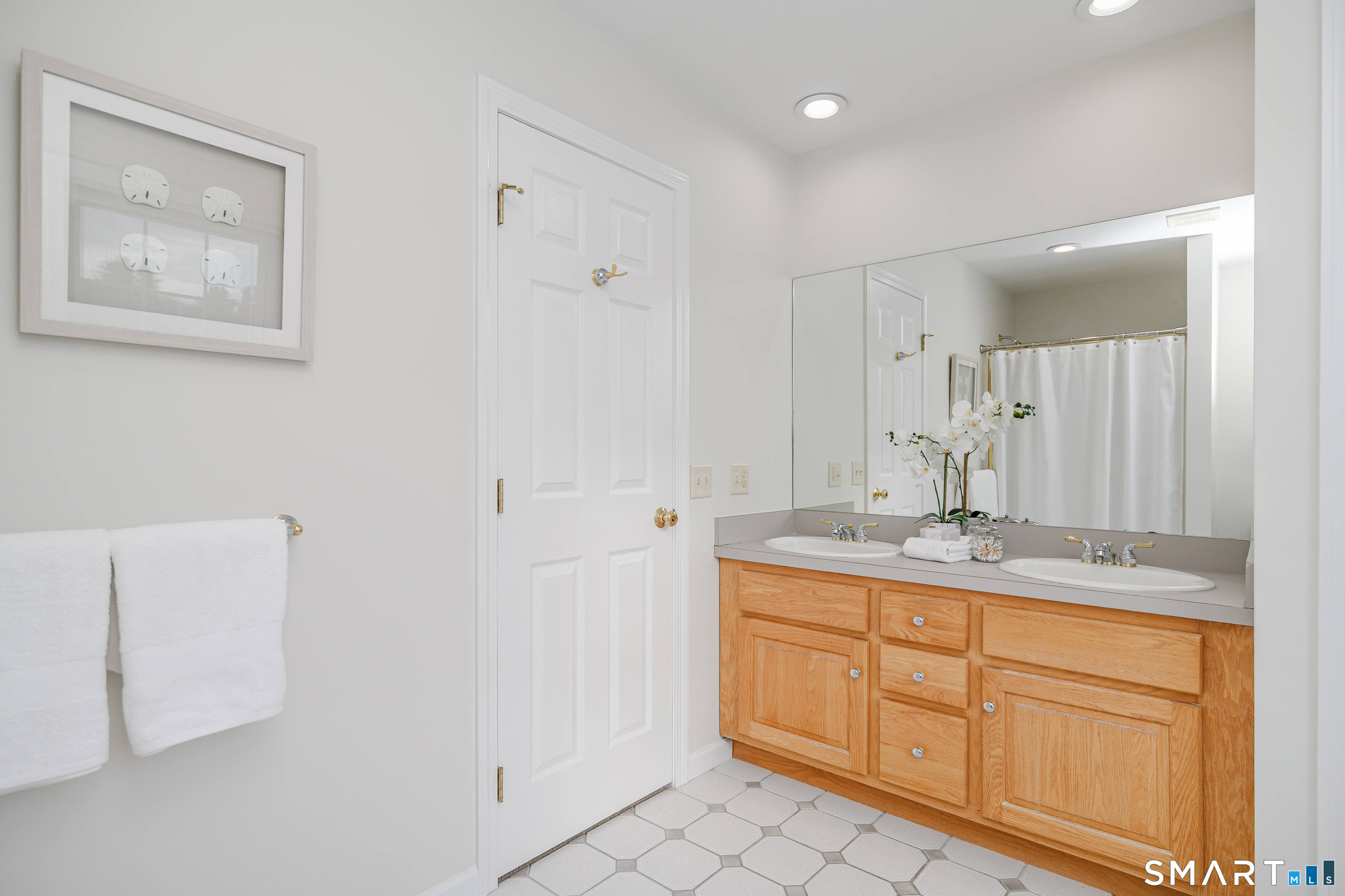 73 Dodgingtown Road Newtown, CT 06470 - Photo 5 of 39 a bathroom with a granite countertop sink a mirror and a