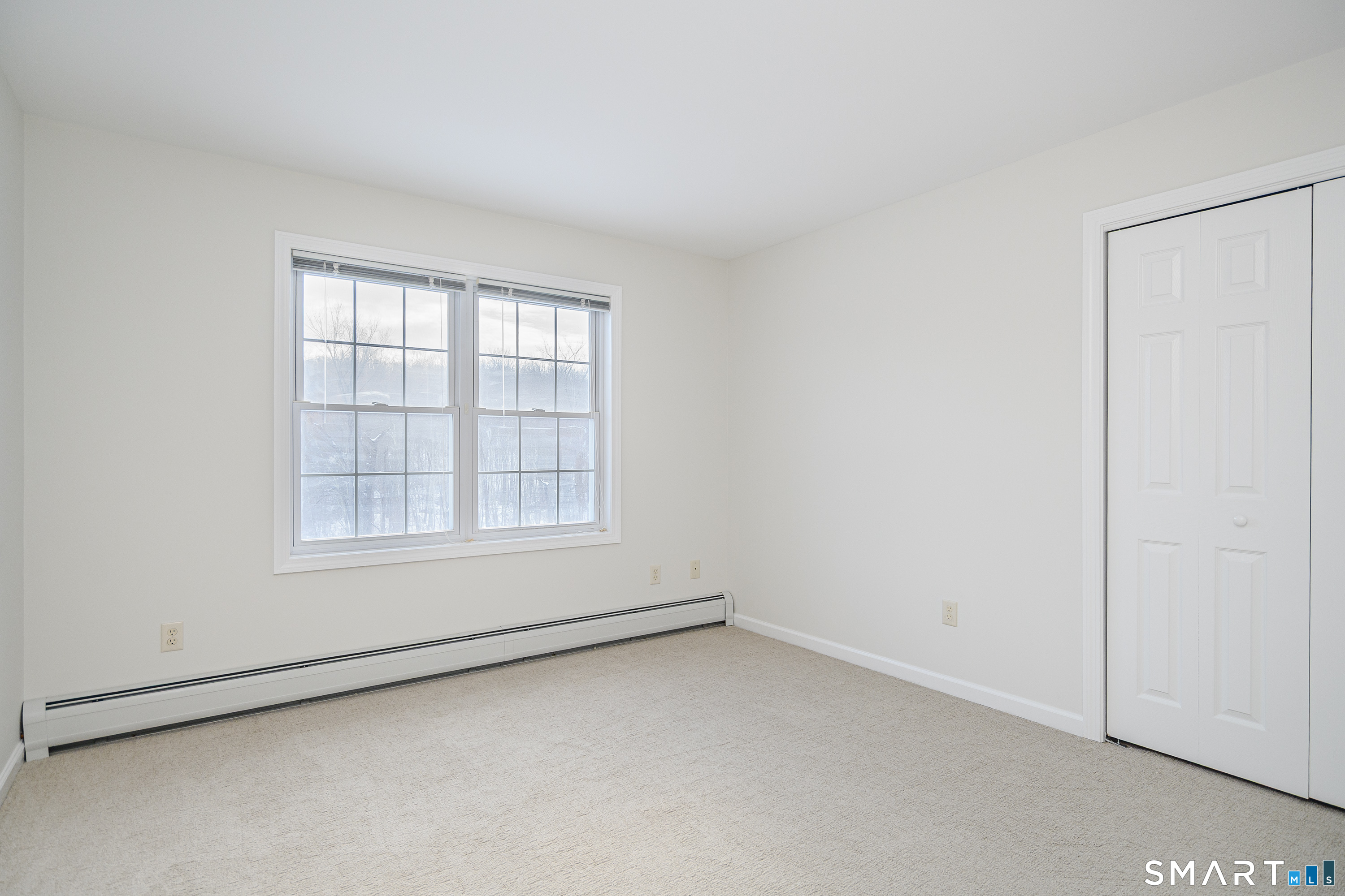 73 Dodgingtown Road Newtown, CT 06470 - Photo 7 of 39 an empty room with a window
