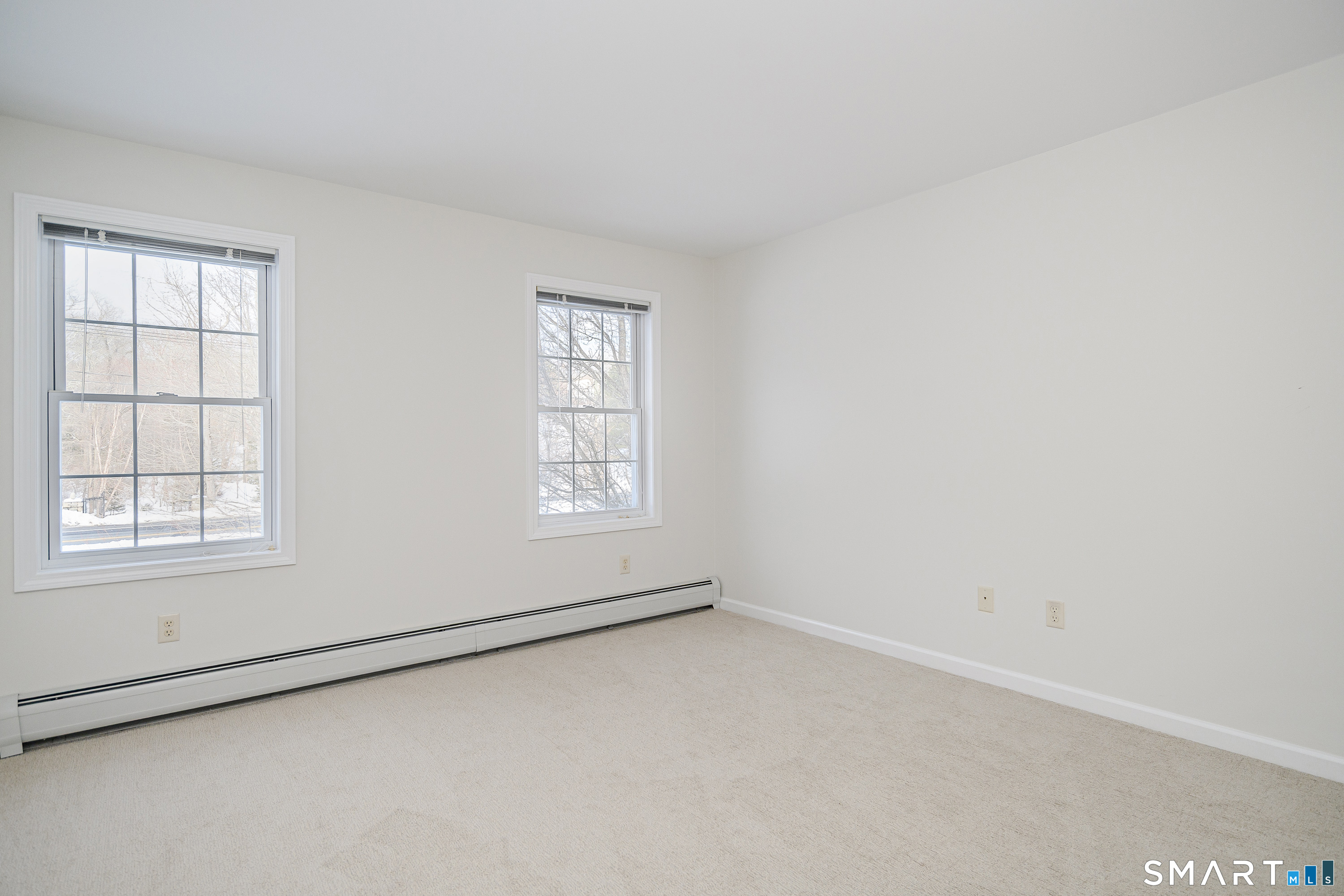 73 Dodgingtown Road Newtown, CT 06470 - Photo 9 of 39 an empty room with windows