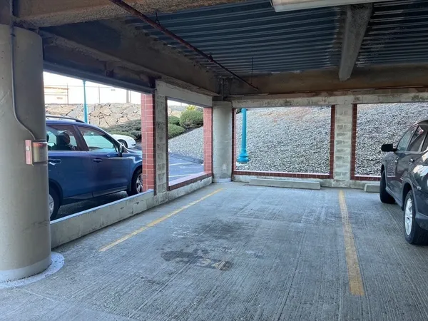 a view of an empty room with windows