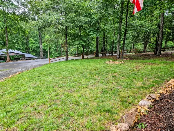 a view of outdoor space with deck and trees