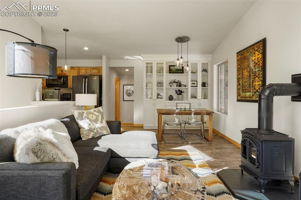 529 Spruce Circle Divide, CO 80814 - Photo 10 of 38 Up the stairs to the main level living room with cozy stove (propane).
