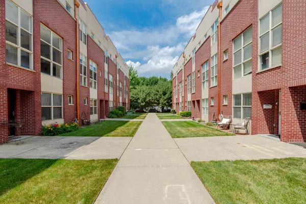 a view of a building with a yard